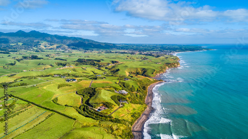 Aerial view on a vineyard and small farms at the foot of Mount Taranaki. Taranaki region, New Zealand photo