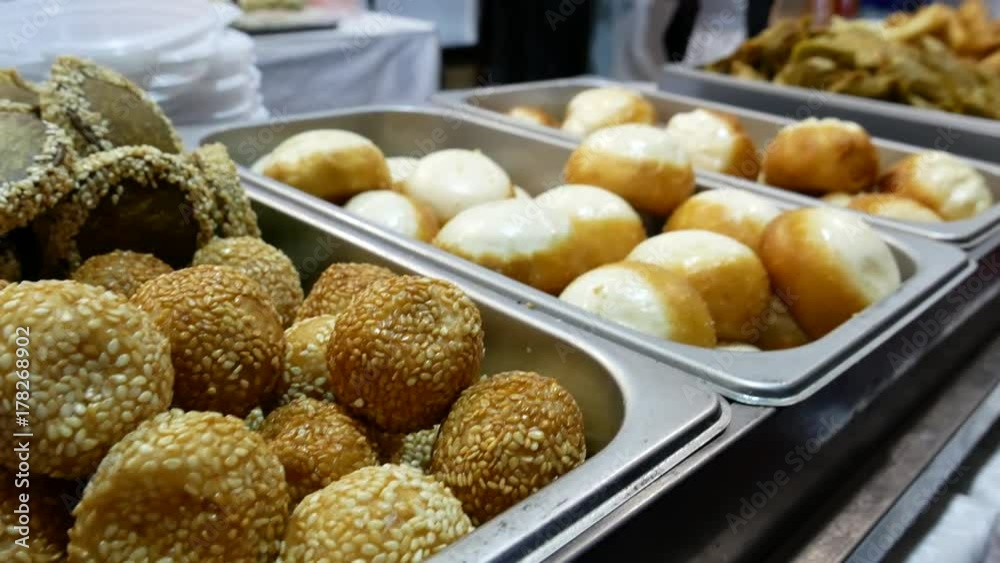 Fried sweet balls with sesame. Asian street food from the stand. Fried sweet balls with sesame. Asian street food from the stand.