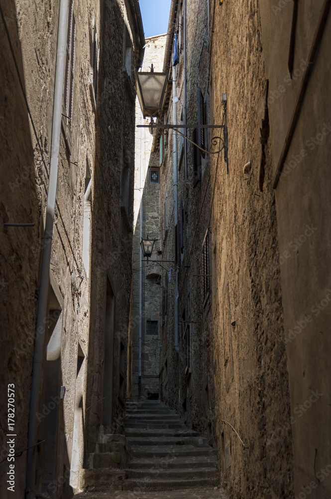 Beautiful street of captivating medieval town of Cortona in Tuscany, Italy. It is an ancient Etruscan hill town, full of narrow steep streets, intimate piazzas, stunning artwork and historical museums Beautiful street of captivating medieval town of Cortona in Tuscany, Italy. It is an ancient Etruscan hill town, full of narrow steep streets, intimate piazzas, stunning artwork and historical museums