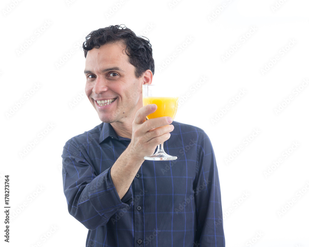 Healthy man drinks orange juice. The person is wearing dark blue social shirt. Isolated.. Healthy man drinks orange juice. The person is wearing dark blue social shirt. Isolated..