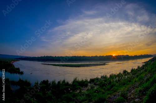 Beautiful sunset in Chitwan National Park  is mainly covered by jungle  fish eye effect