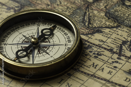 Retro compass with old map