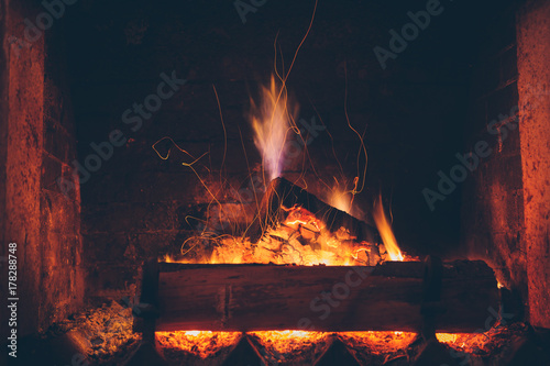 Sparking fire in fireplace photo