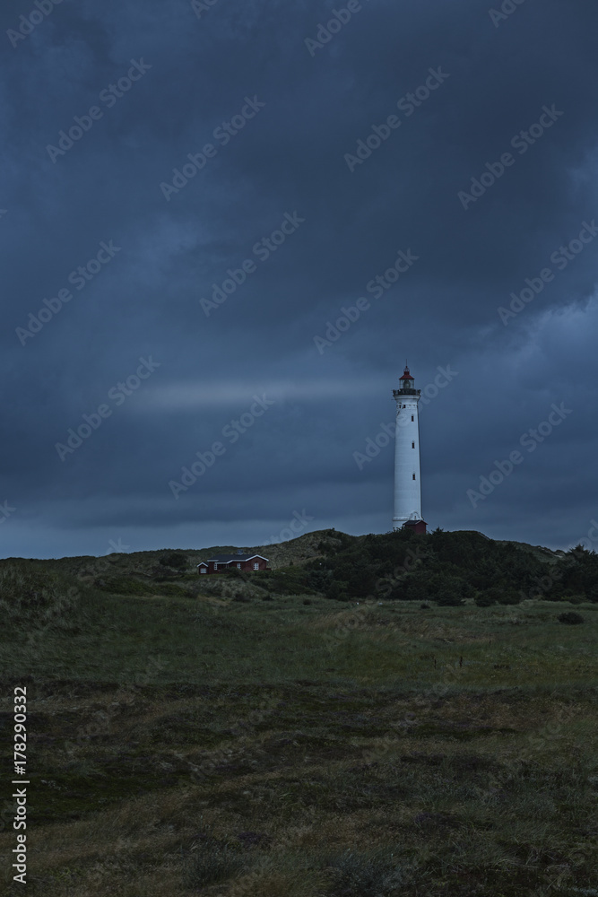Lighthouse and little red house Lighthouse and little red house