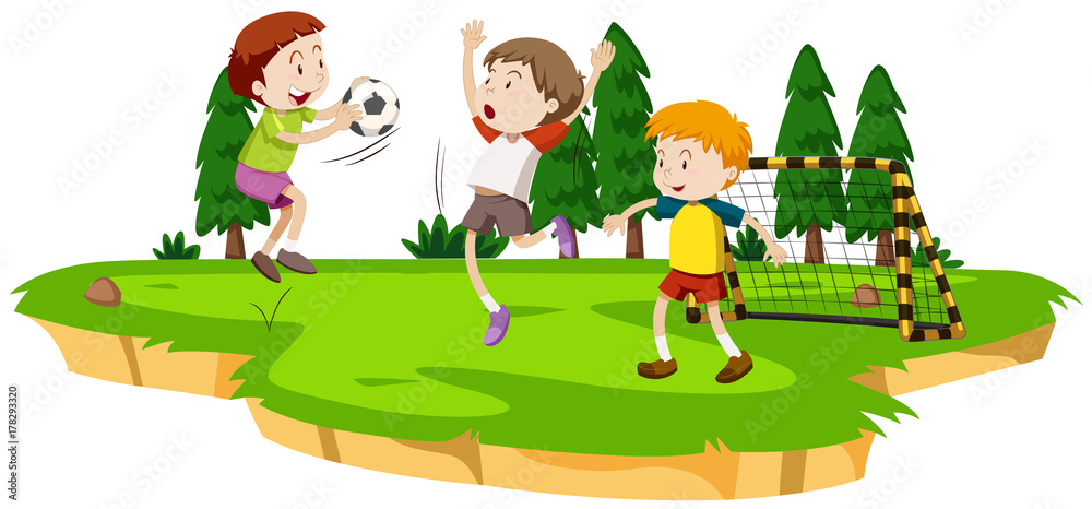 Boys playing soccer in the field