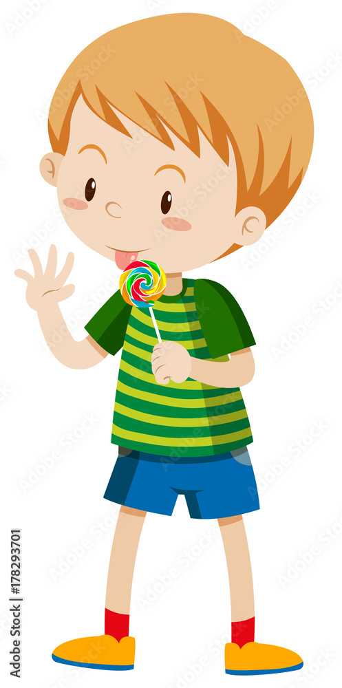 Little boy licking lollipop