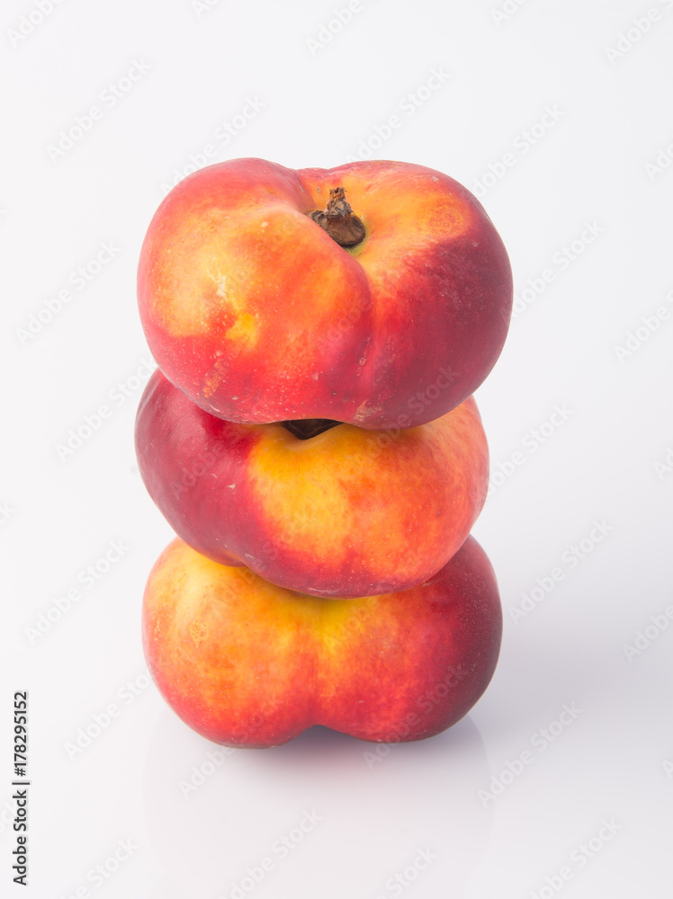 flat peaches (donut peaches) on a background flat peaches (donut peaches) on a background
