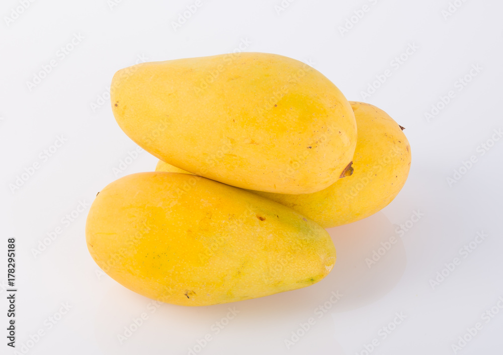 yellow mango fruit on a background