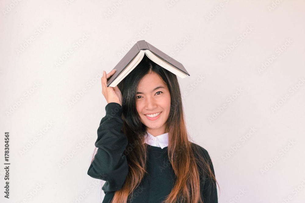 Young asian Student woman holding book with copy space Young asian Student woman holding book with copy space
