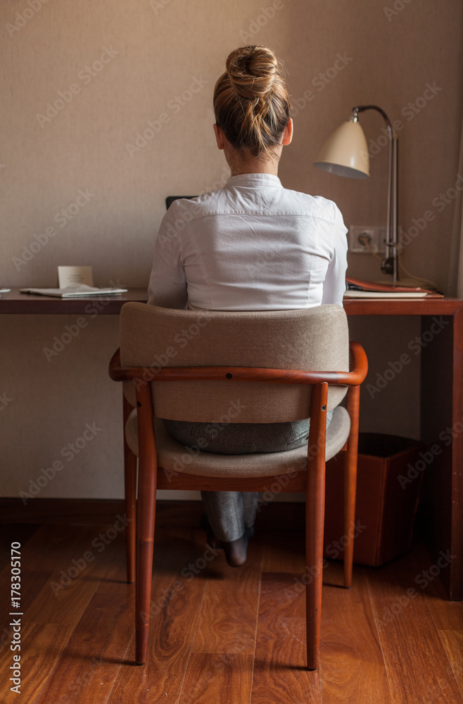 Back Shot of a Businesswoman in a Hotel Room Back Shot of a Businesswoman in a Hotel Room
