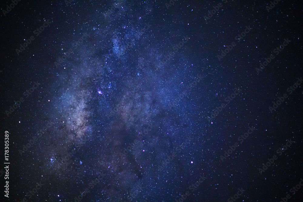 Fototapeta premium Milky way galaxy with stars and space dust in the universe, Long exposure photograph, with grain.