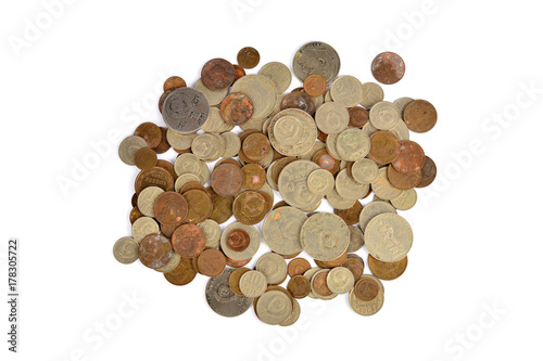 A pile of scattered coins on white background