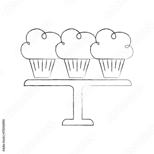 three birthday cupcakes arranged on a serving tray