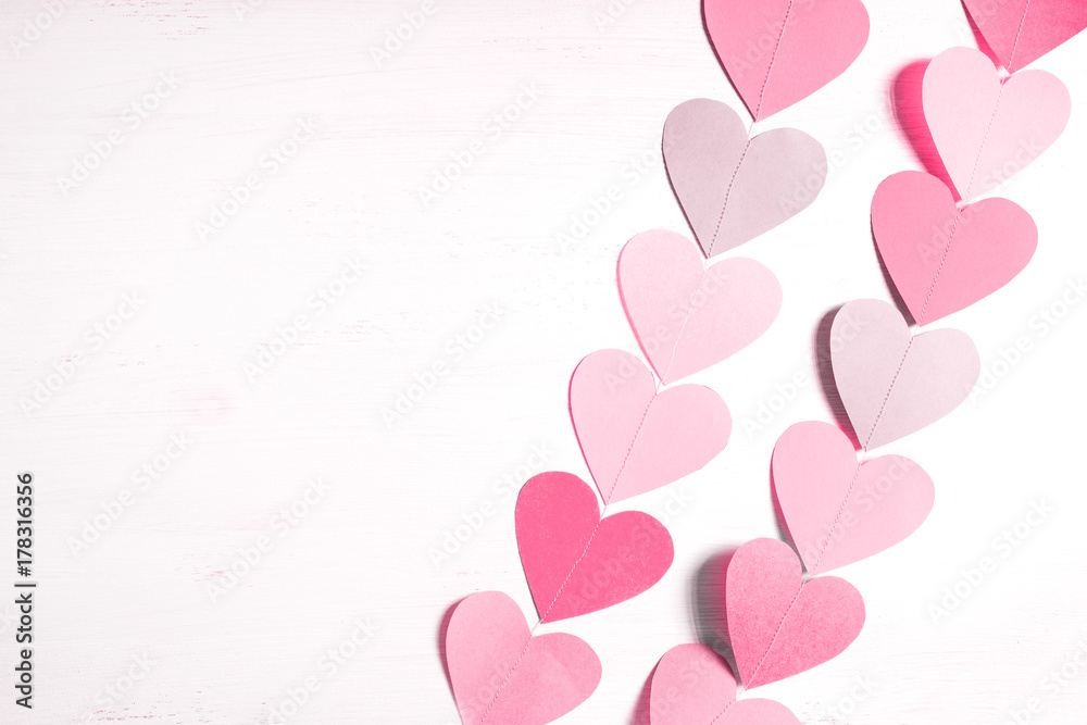 Garland of hearts in pink tones.