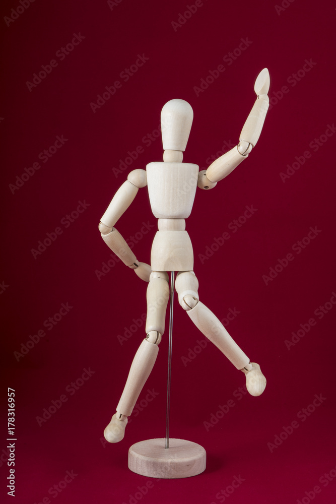 a wooden dummy dancing with red background a wooden dummy dancing with red background