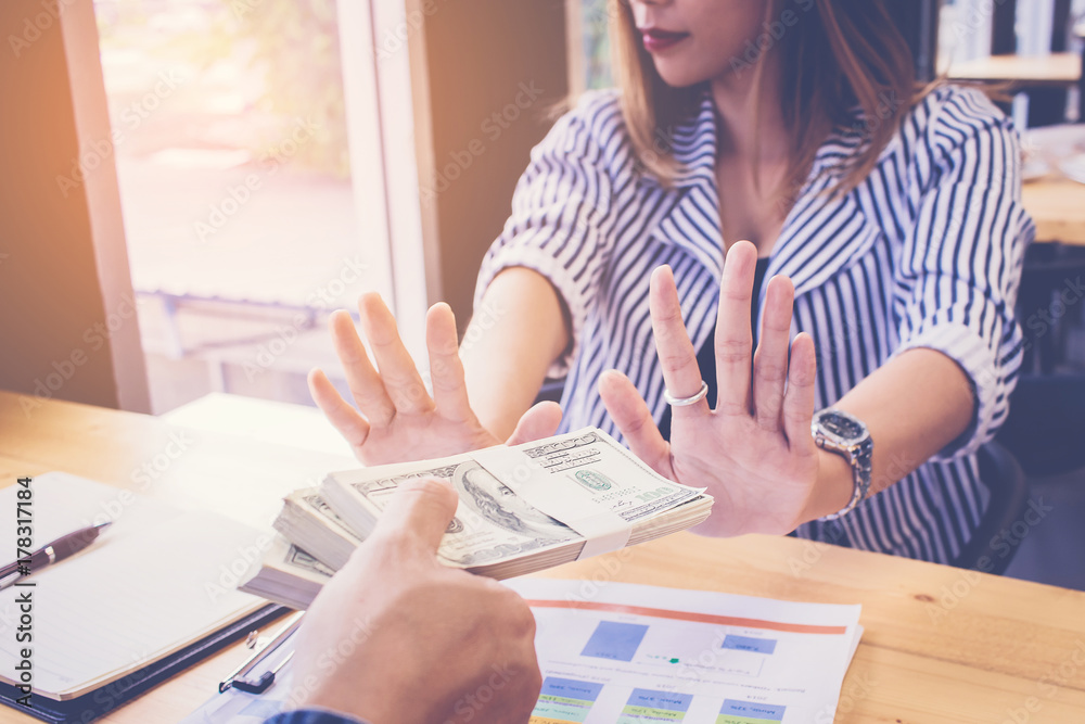 businesswoman refusing to take bribe and cancel signing contract. corruption concept businesswoman refusing to take bribe and cancel signing contract. corruption concept
