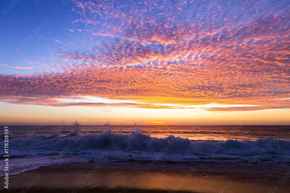 against the sunset light on the beach,Phuket Thailand