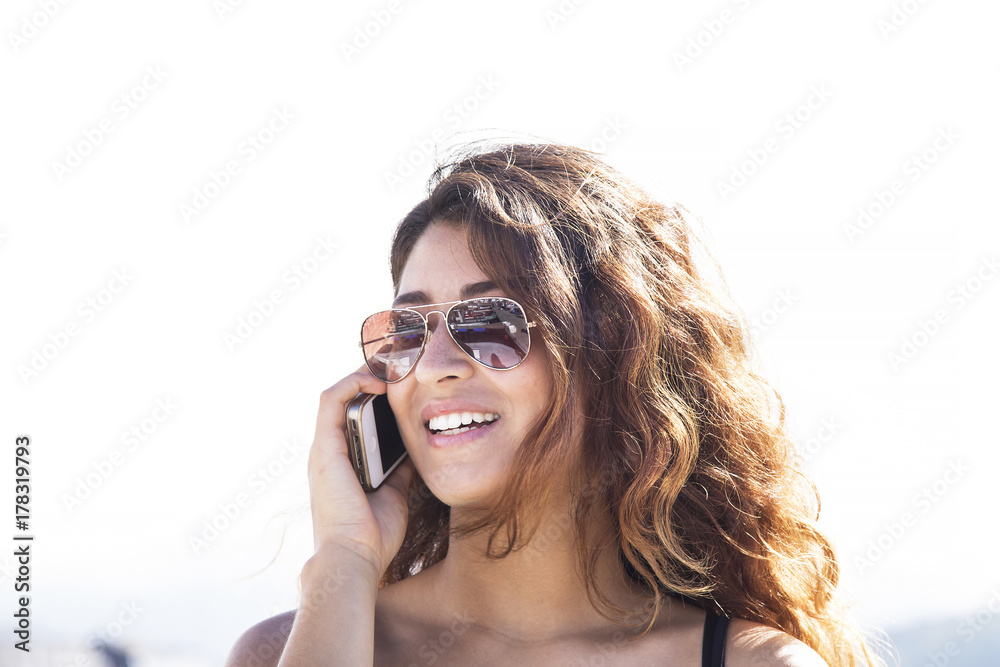 girl in the marina talking with her cellphone girl in the marina talking with her cellphone