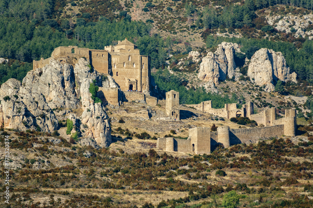 Medieval castle of Loarre over the rocks with surrounding wall Medieval castle of Loarre over the rocks with surrounding wall