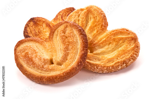 Puff pastry cookies with sugar, isolated on white background photo