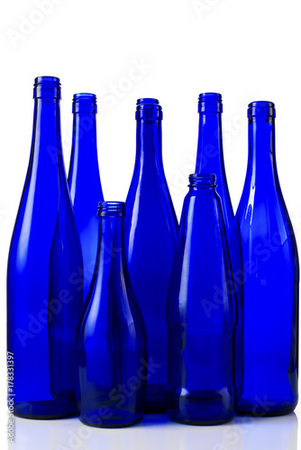 Blue bottles for wine on white background
