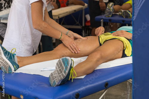 Athlete's Muscles Massage after Sport Workout photo