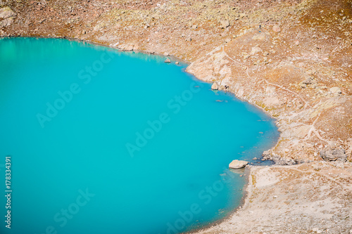 Beautiful turquoise or blue alpine lake in the mountains
