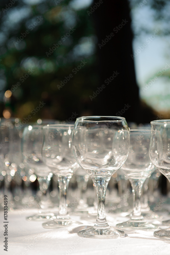 A row of empty champagne glasses A row of empty champagne glasses