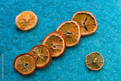 Dried oranges on azure bath salts