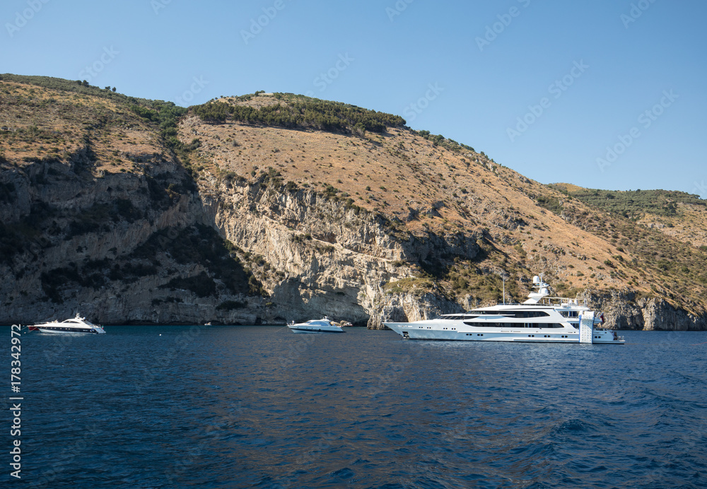 Luxury crewed motor yacht on the Amalfi Coast near Positano, Campania. Italy