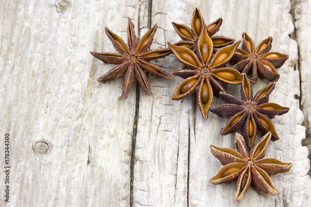 star anise on wooden background star anise on wooden background