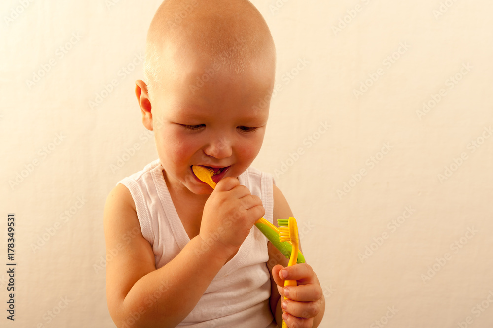 Caucasian boys brush their teeth with a toothbrush. Caucasian boys brush their teeth with a toothbrush.