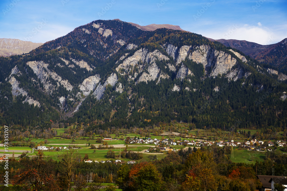 Italian Alps in autumn, stunning views of the background of the small town