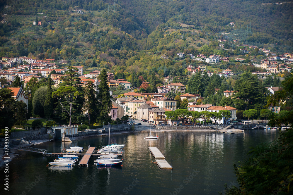 A small cozy town near Lake Como against the background of the huge Alpine mountains