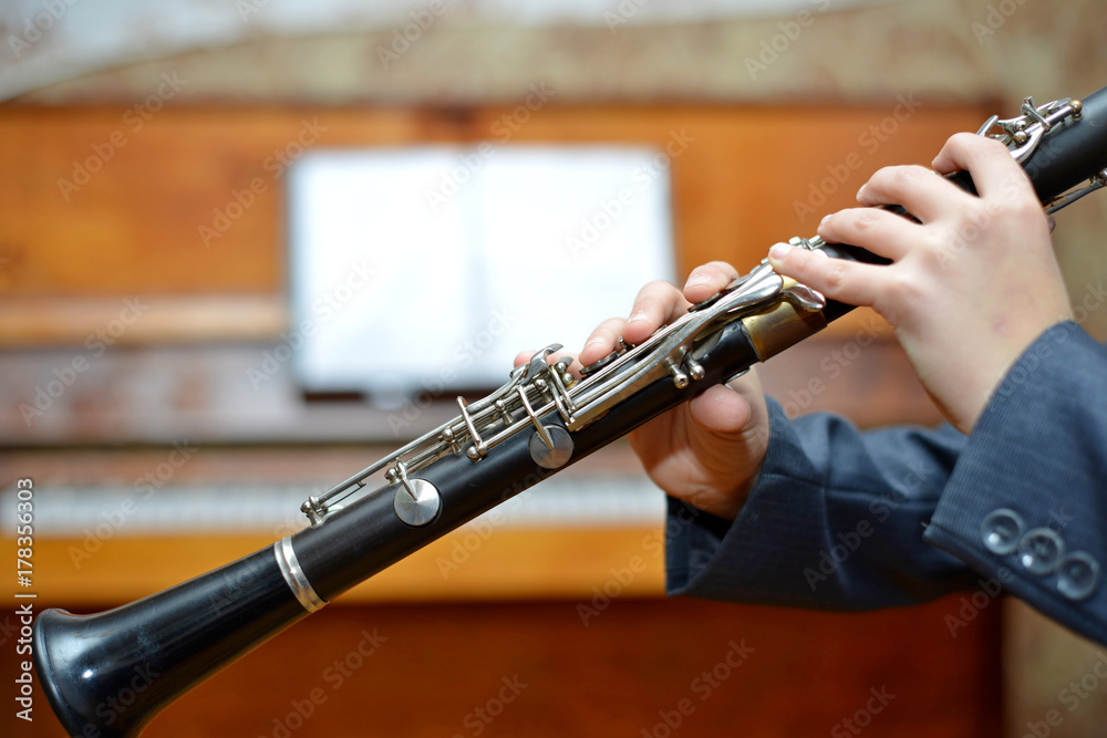 Fototapeta premium Boy playing the clarinet