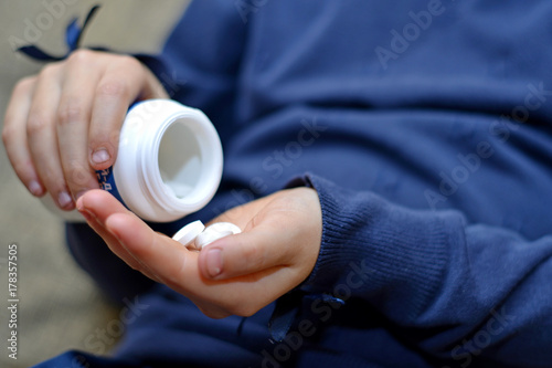 Small child taking medicine