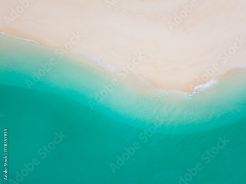 Summer Beach top view or aerial view showing shade of emerald water and wave