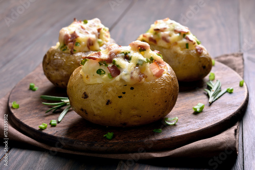 Stuffed potato with bacon, cheese and green onion