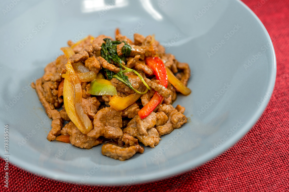 wok fried chicken stir fry with sweet peppers and chinese vegetables