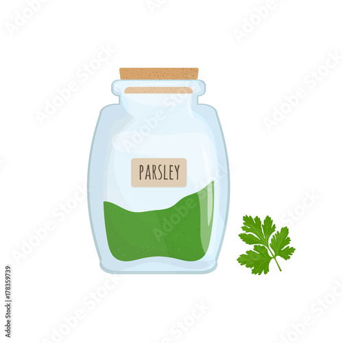 Minced and dried parsley stored in glass jar isolated on white background