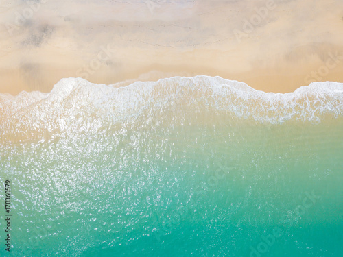 Beach top view with wave foam