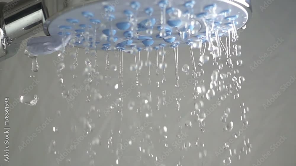 Water sprays out of shower head, slow motion Water sprays out of shower head, slow motion