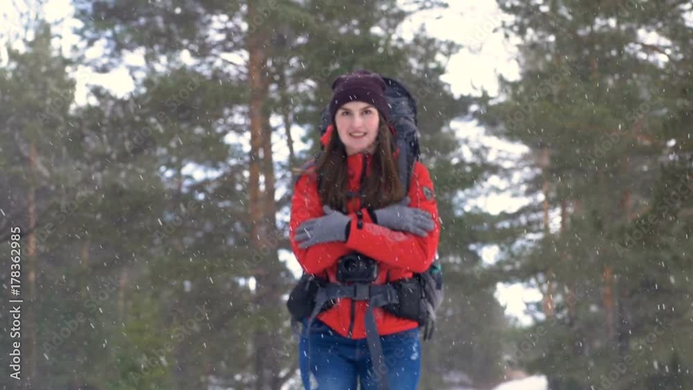 Tourist in a frosty weather getting cold under snow. Tourist in a frosty weather getting cold under snow.