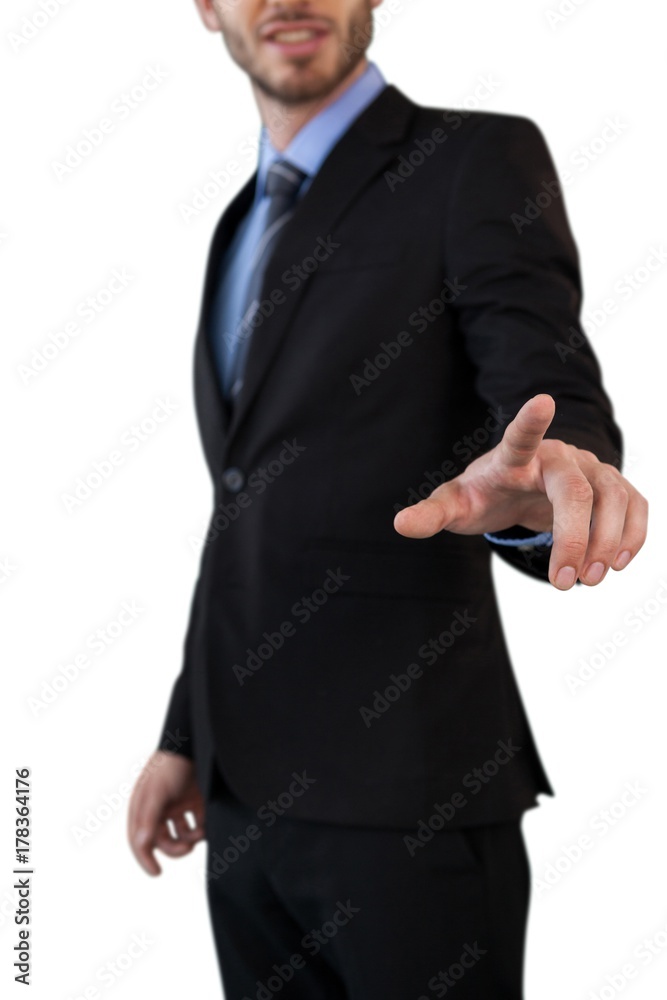 Mid section of businessman in suit touching index finger on Mid section of businessman in suit touching index finger on