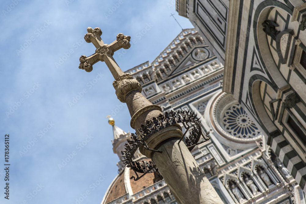 The renaissance cathedral Santa Maria Fiore in Florence in Italy, viewing the crucifix in front of the Dome.