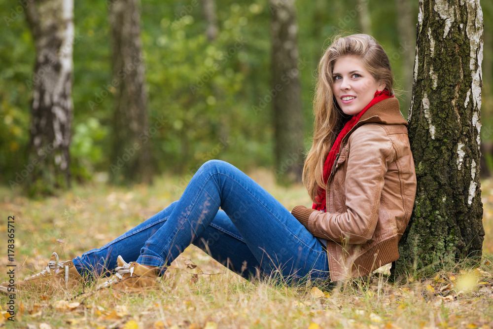 Beautiful smiling autumn woman with long hair Beautiful smiling autumn woman with long hair
