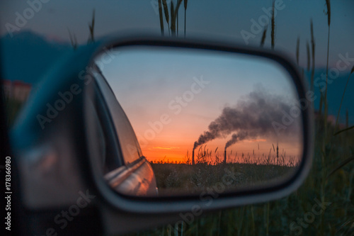 Industrial smoke from chimney at sunset, steppe near Almaty, Kazakhstan