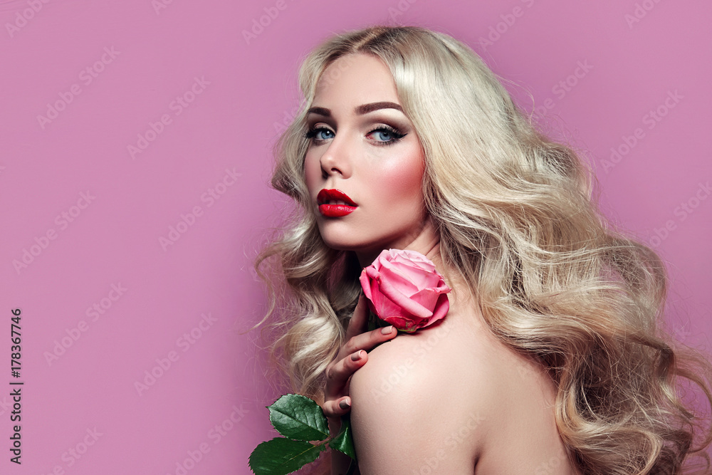 Young Blonde Girl With A Pink Rose