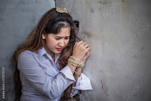 A murderer/terrorist/prisoner man holding gun kidnapping young woman for a hostage/rape/intimidate, violence/robbery/killer concept,Hostage a business woman.