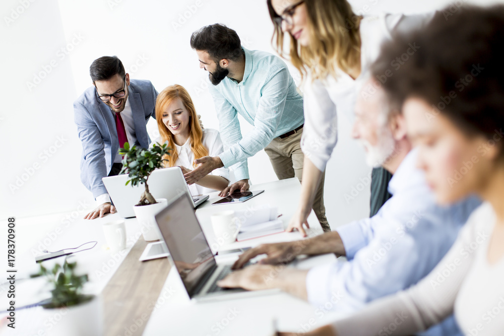 Joyful multiracial business team at work in modern office Joyful multiracial business team at work in modern office